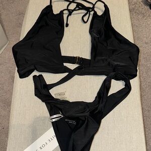 white fox swim one piece. NWT. size medium
